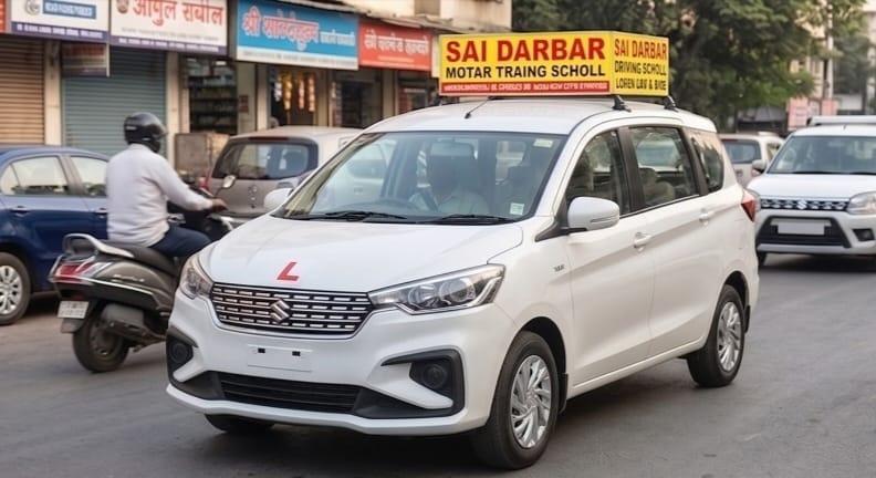 White Suzuki Ertiga Front View - Sai Darbar Motor Training School Thane
